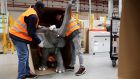 Amazon employees pack a model elephant in special packaging at the Amazon logistic and distribution center. The United States’ strong run of uninterrupted jobs growth came to a near halt in February,  department of labour data showed. Photograph: Friedemann Vogel/EPA