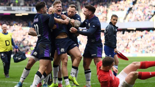 Darcy Graham of Scotland celebrates scoring his side’s first try during the Six Nations match against Wales at Murrayfield. Photograph: Stu Forster/Getty Images