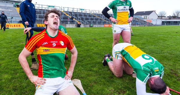 Carlow’s Sean Whelan celebrates victory while Offaly’s Pat Camon shows his  dejection after the Division 1B relegation play-off at O’Connor Park, Tullamore. Photograph: Tom O’Hanlon/Inpho