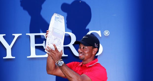 Tiger Woods lifts The Players trophy in 2013. Photograph: Andy Lyons/Getty