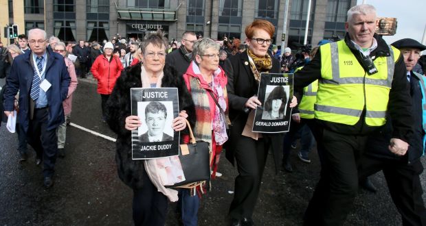 Family members of victims of the Bloody Sunday killings walk in procession holding portraits of their killed relatives in Derry  on March 14th. Photograph:  Paul Faith / AFP/Getty Images