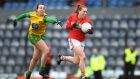 Ashling Hutchings of Cork gets away from Donegal’s  Nicole McLaughlin during the Lidl Ladies NFL Division 1  match  at Páirc Uí Rinn. Photograph: Eóin Noonan/Sportsfile