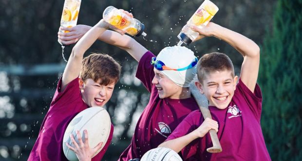Graham Ball, Darragh Ball and Iarlaith McElroy at the launch of the Doora Barefield Community Games new waste reduction initiative: a reusable water bottle. Photograph: John Kelly