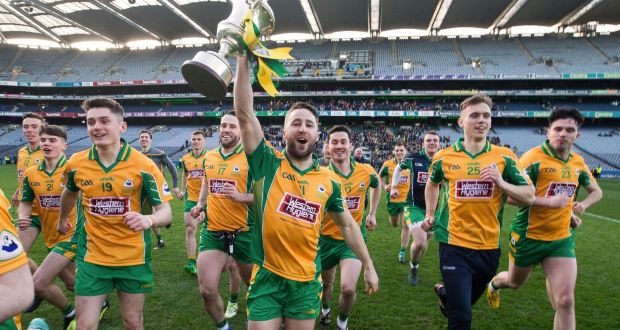 Corofin’s Michael Lundy holds aloft the Andy Merrigan Cup after their victory over Dr Crokes in the All-Ireland senior club football championship final at Croke Park. Photograph: Tommy Dickson/Inpho