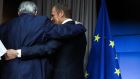 European Commission president Jean-Claude Juncker and European Council president Donald Tusk embrace after a joint news conference in Brussels. Photograph: Yves Herman/Reuters