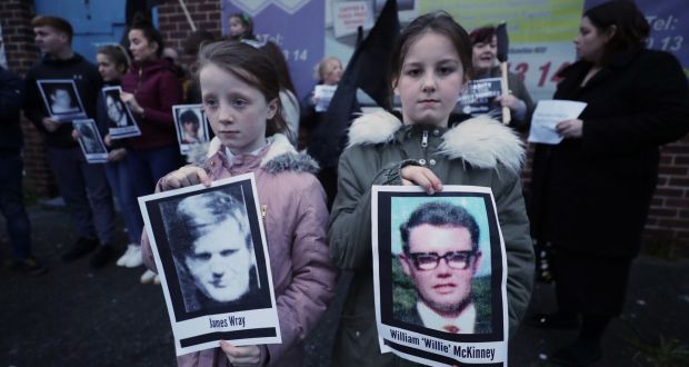Two children hold pictures of Bloody Sunday victims James Wray and William McKinney during a vigil in Belfast on March 14th. Photograph: Niall Carson/PA Wire