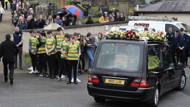 Edendork football team members form a guard of honour for friend Connor Currie’s final journey. Photograph: Charles McQuillan/Getty