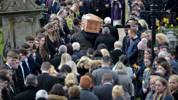 Mourners flank the pall-bearers at Conor Currie’s funeral of Connor Currie. Photograph: Charles McQuillan/Getty