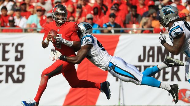Efe Obada tackles Jameis Winston of the Tampa Bay Buccaneers. Photograph: Mike Ehrmann/Getty