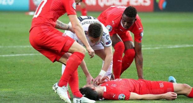 Fabian Schar was allowed to play on against Georgia despite being knocked unconscious. Photograph: Irakli Gedenidze/Reuters