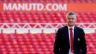 Ole Gunnar Solskjær walks next to the pitch at Old Trafford after being announced as the new manager of Manchester United on Thursday. Photograph: Peter Powell/EPA