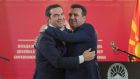 Greek prime minister Alexis Tsipras (left) and Macedonian prime minister Zoran Zaev  embrace at a news conference in Skopje on Tuesday. Photograph: Robert Atanasovski/AFP/Getty Images