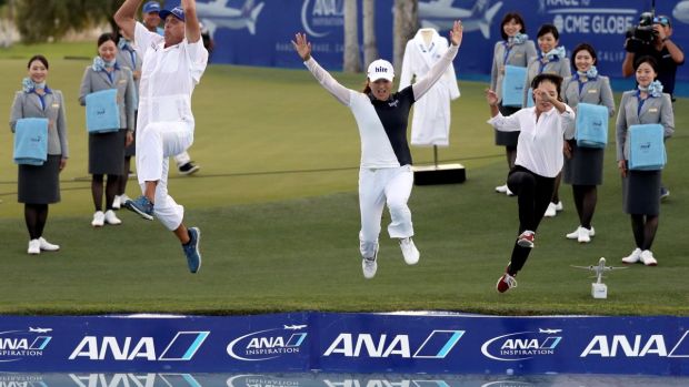 Jin Young Ko, her caddie David Brooker, and her agent Soo jin Choi, leap into Poppie’s Pond next to the 18th green after her win during of the ANA Inspiration at Mission Hills Country Club in Rancho Mirage, California. Photograph: Matthew Stockman/Getty Images