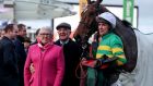 Trainer Ted Walsh and his wife Helen celebrate Any Second Now’s  victory in the Kim Muir Chase at Cheltenham  with  jockey Derek O’Connor. Photograph: Dan Sheridan/Inpho 