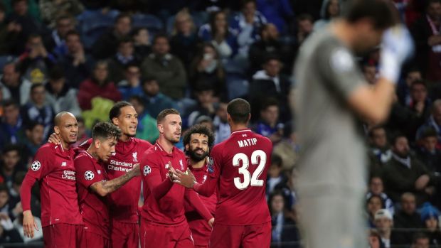 Liverpool’s Virgil van Dij celebrates after scoring against Porto.