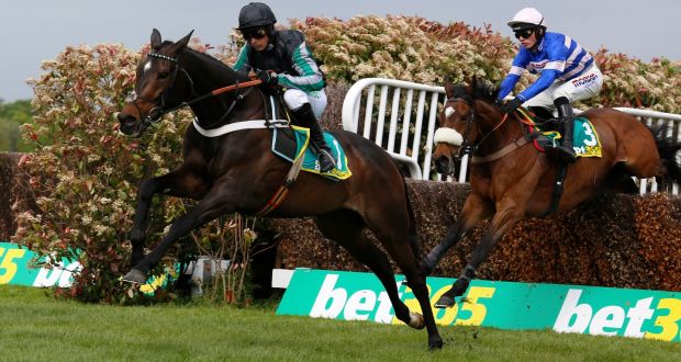 Altior and Nico de Boinville clear an early fence on the way to winning the  bet365 Celebration Chase Race run at Sandown Park. Photograph: Julian Herbert/PA Wire