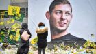 People look at yellow flowers displayed in front of the portrait of Argentinian forward Emiliano Sala at the Beaujoire stadium in Nantes, in  February. Photograph:  Loic Venance/AFP/Getty Images