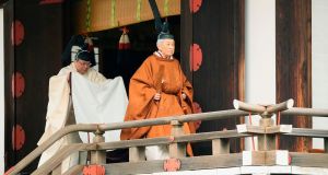 Japan’s Emperor Akihito (R) leaves after a ritual to report his abdication to the throne, at the Imperial Palace in Tokyo,  on Tuesday. Photograph: Japan Pool via AP
