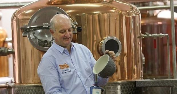 Pat Rigney, managing director of The Shed Distillery, pictured filling the first ever bottle of Drumshanbo Gunpowder Irish Gin