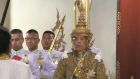 IThailand’s King Maha Vajiralongkorn, right, sits on the throne as he is officially crowned king at the Grand Palace. Photograph: Thai TV Pool/AP