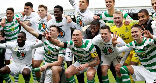 Celtic celebrate after securing the league title against Aberdeen. Photograph: Ian MacNicol/Getty