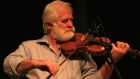 John Sheahan: Fiddle player, composer, poet, wood carver and origami enthusiast.