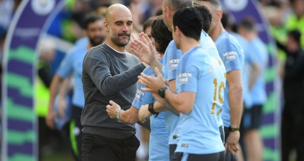 Manchester City manager Pep Guardiola celebrates winning the Premier League title following their 4-1 defeat of Brighton & Hove Albion  at American Express Community Stadium. Photograph: Mike Hewitt/Getty Images