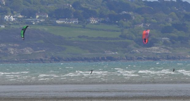 Windsurfers enjoying the good weather at Dollymount Beach, Dublin on Monday. Photograph:  Collins