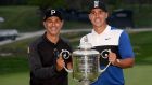 Brooks Koepka and  caddie Ricky Elliott with  the Wanamaker Trophy  at the Bethpage Black course in New York. Photograph: Ross Kinnaird/Getty Images
