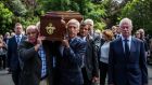  Fran Ryder, Bobby Doyle (right), Kevin Moran (behind) and other members of the 1970s Dublin team carry the coffin of their former team-mate Anton O’Toole into the Mount Argus church in Kimmage. Photograph: James Forde