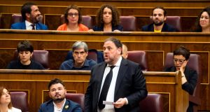 Jailed Catalan politician Oriol Junqueras takes the oath as a deputy during the first session of parliament following a general election in Madrid. Photograph: Angel Navarrete/Pool via Reuters