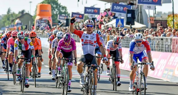 Australian rider Caleb Ewan (C) of Lotto Soudal team celebrates winning the 11th stage of the Giro d’Italia. Photo: Alessandro Di Meo/EPA