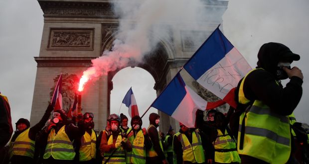Yellow-vest (gilets jaunes) protestors at the Arc de Triomphe in Paris during a demonstration over high fuel prices in December, 2018. Photograph: Yoan Valat/EPA