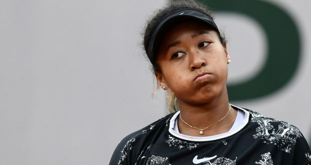 Japan’s Naomi Osaka reacts during her  first-round match against Slovakia’s Anna Karolina Schmiedlova at the Franch Open. Photograph: Philippe Lopez/AFP/Getty Images