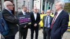 Gerry Carson of the NUJ, Patrick Corrigan of Amnesty International, journalists Trevor Birney and Barry McCaffrey and Conservative MP and former Brexit secretary David Davis outside the high court in Belfast on Tuesday. Photograph:   Jonathan Porter/PressEye