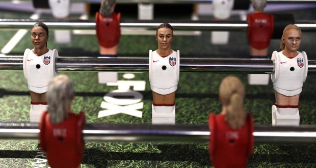 USA soccer player Carli Lloyd (centre) is seen in foosball figurine form, surrounded by representations of her teammates ahead of the Fifa Women’s World Cup. Photograph: Timothy A Clary/AFP