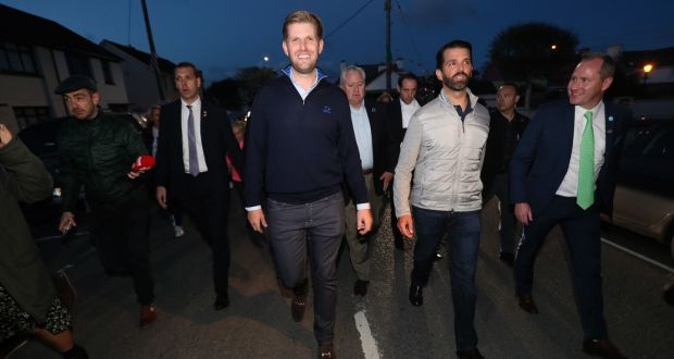 Donald  jnr (second right), and Eric Trump (centre),  in Doonbeg,  with   golf resort director of membership Brendan Murphy (in green tie). Photograph: Brian Lawless/PA 