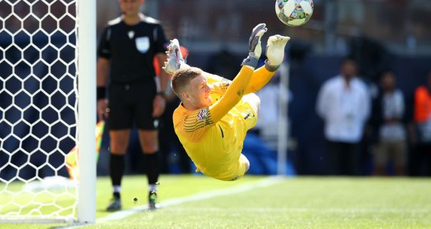 Jordan Pickford saves Josip Drmic’s penalty to see England beat Switzerland on penalties. Photograph: Jan Kruger/Getty