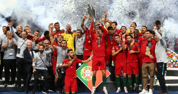 Cristiano Ronaldo of Portugal lifts the Nations League trophy. Photograph: Dean Mouhtaropoulos/Getty Images