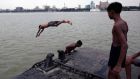 Boys jump into the Ganges river to cool off during hot weather in Kolkata, India, on June 11th. Photograph:   Piyal Adhikary/EPA