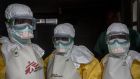 Healthcare workers put on protective gear at Goma’s only Ebola treatment centre. They’re  supposed to wear these outfits for a maximum of only 45 minutes, because of how hot it becomes inside. Photograph: Sally Hayden