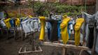 Wellies and gloves hang out to dry after being sprayed with chlorine and water, in Goma’s only Ebola treatment centre. Photograph: Sally Hayden 