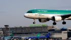 An Aer Lingus plane lands at Dublin Airport. Minister for Transport Shane Ross has published draft laws to change how the State regulates air travel. File photograph: Aidan Crawley