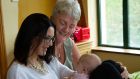 Emma Brodbin and her baby girl Nadia with Community Mother Margaret Waters at Clonmel Community Resource Centre, Co Tipperary.