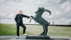 Dubai Duty Free Irish Open host Paul McGinley pictured beside the  The Rampant Goat bronze at Lahinch Golf Club, host of next week’s event. Photograph:   Brian Arthur