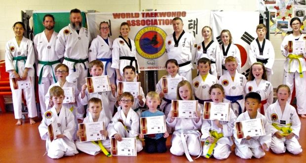 Greville Stockil (right of centre at back) with his class after a recent presentation of colour belt promotion certificates in Thurles, Co Tipperary.