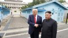 US president Donald Trump meets North Korean leader Kim Jong-un at the demilitarised zone. Photograph: Kevin Lamarque/Reuters