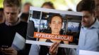 Demonstrators hold a banner reading ‘Free Carola’ during a vigil  in Cologne, Germany, for Carola Rackete. Photograph: Federico Gambarini/dpa/AFP/Getty Images