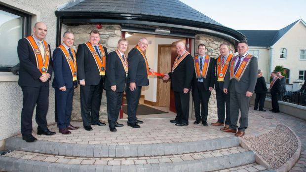 Grand master of the Grand Orange Lodge of Ireland Edward Stevenson cuts the ribbon at the official opening of the restored Newtowncunningham Orange Hall last year. File photograph: Orange Order/PA Wire