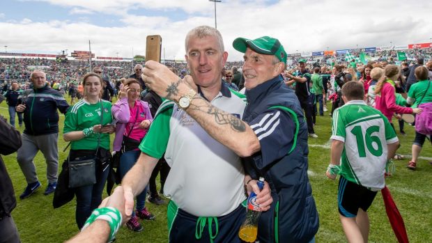 Limerick manager John Kiely is congratulated after his team’s Munster final victory. Photograph: Morgan Treacy/Inpho